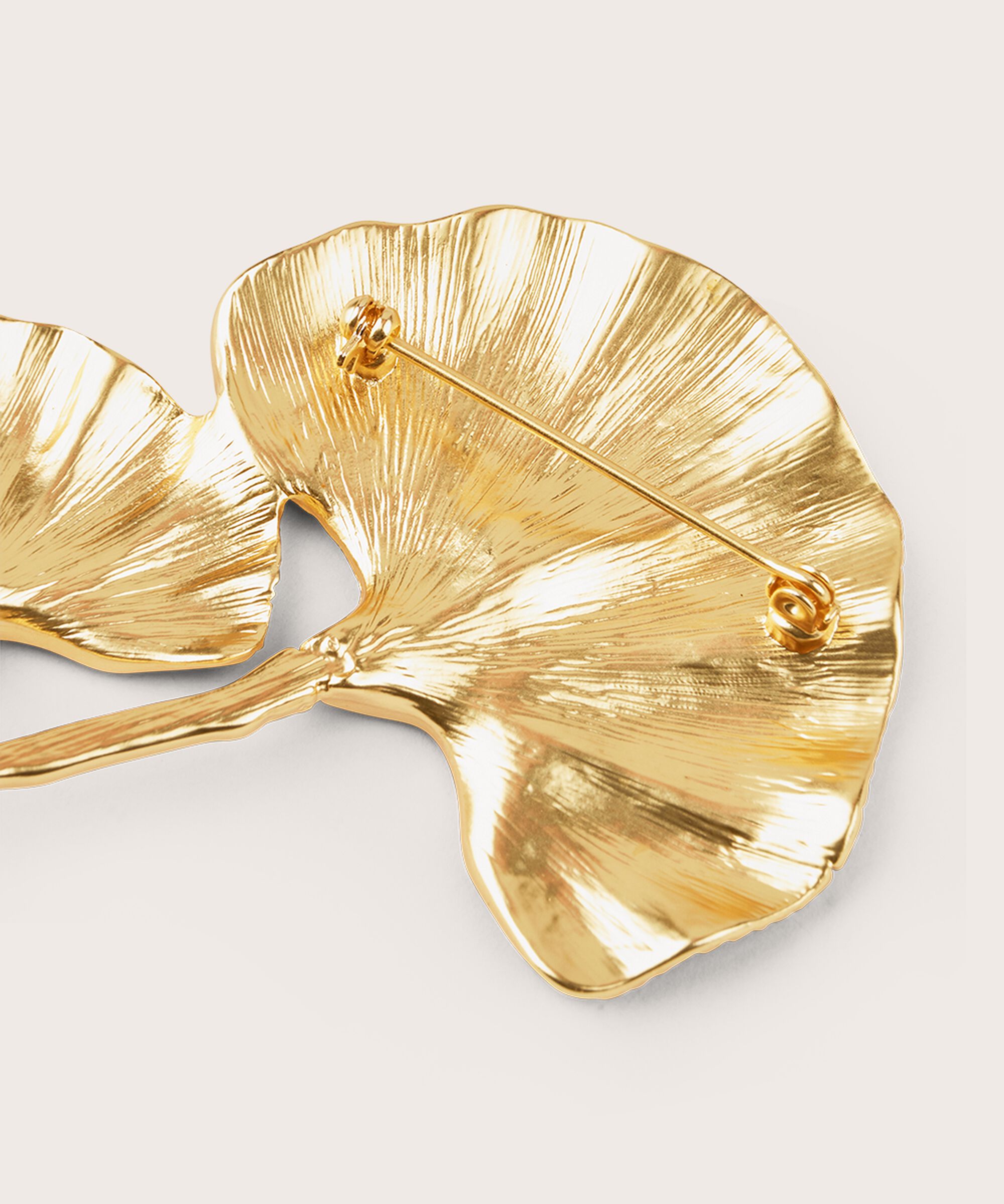 Rollin Broche, Gold